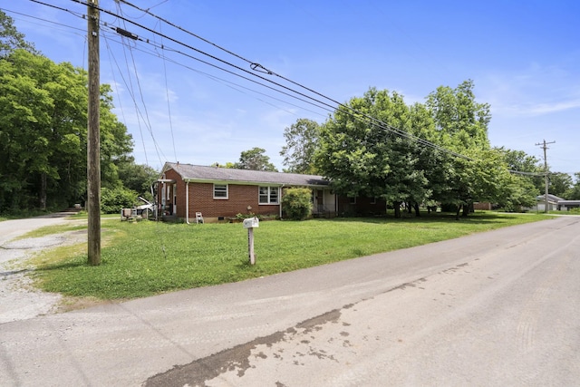 604 2nd Ave, Lawrenceburg, TN 38464 - single story home with a front yard and brick siding