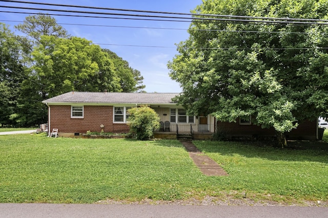 604 2nd Ave, Lawrenceburg, TN 38464 - view of front of home with brick siding, a front yard, and a porch