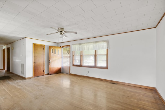 604 2nd Ave, Lawrenceburg, TN 38464 - unfurnished room featuring wood finished floors, ceiling fan, and crown molding