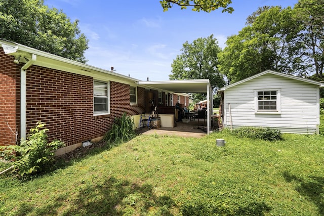 604 2nd Ave, Lawrenceburg, TN 38464 - view of grassy yard with a patio area and a carport
