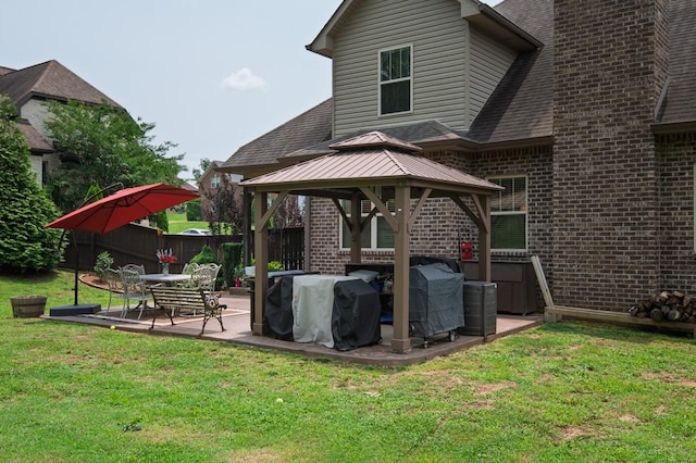 31 Harbor Pt, Lebanon, TN 37087 - rear view of house featuring a gazebo, brick siding, roof with shingles, and a patio area