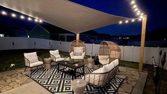 1006 Pepper Stone Dr, Lebanon, TN 37087 - patio at twilight with a patio and a fenced backyard