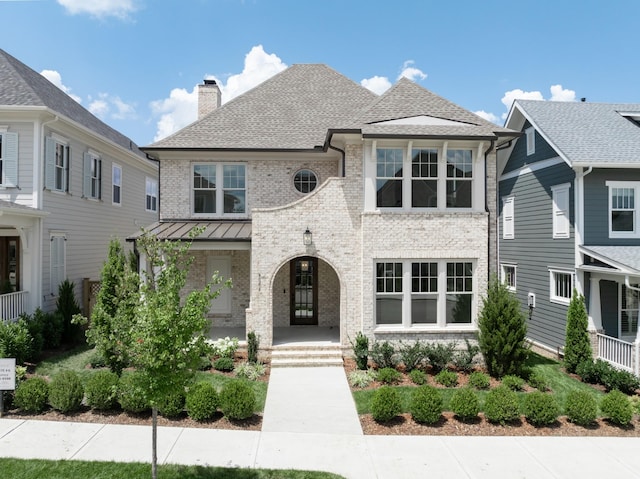 8006 Southvale Blvd, Franklin, TN 37064 - french country inspired facade with brick siding, a chimney, covered porch, and a shingled roof