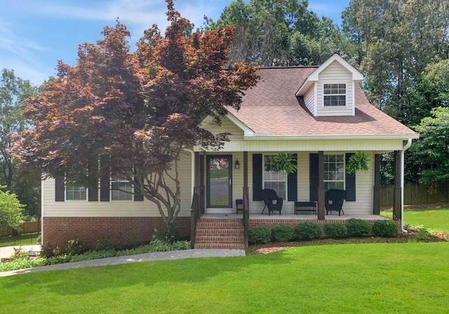 228 Vineyard Dr, Tunnel Hill, GA 30755 - view of front facade featuring a porch and roof with shingles