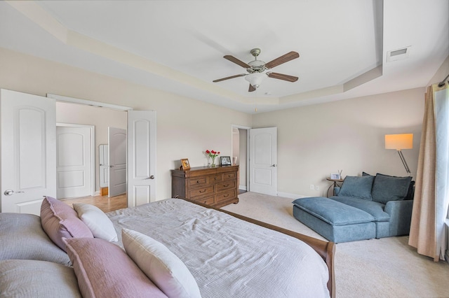 312 Rafferty Ct, Franklin, TN 37064 - bedroom with a raised ceiling, light carpet, and ceiling fan