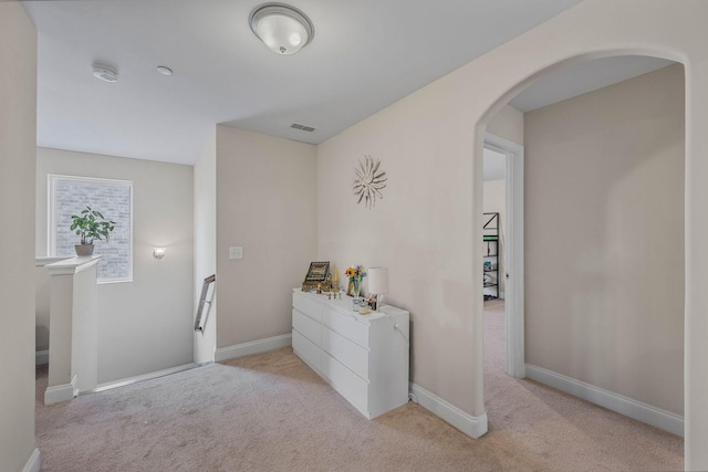 312 Rafferty Ct, Franklin, TN 37064 - hallway with arched walkways and light carpet