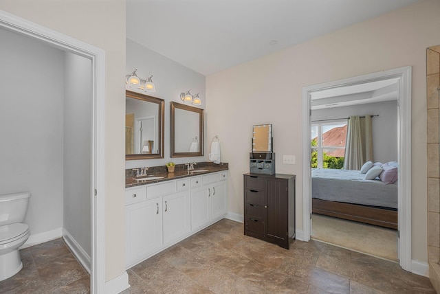 312 Rafferty Ct, Franklin, TN 37064 - bathroom with stone finish floors, double vanity, and ensuite bath