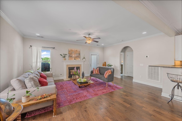 312 Rafferty Ct, Franklin, TN 37064 - living area with arched walkways, wood finished floors, ceiling fan, recessed lighting, and a fireplace with flush hearth