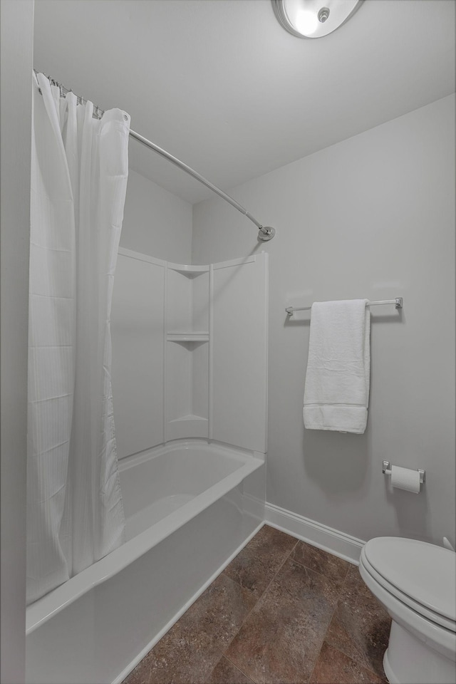 312 Rafferty Ct, Franklin, TN 37064 - bathroom with shower / bath combination with curtain and stone finish flooring