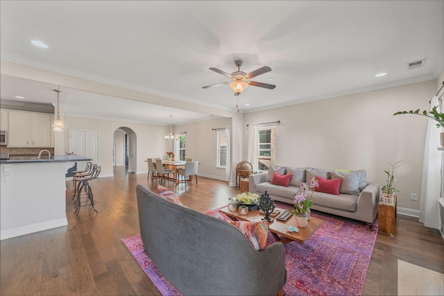 312 Rafferty Ct, Franklin, TN 37064 - living room featuring arched walkways, a ceiling fan, recessed lighting, dark wood-style flooring, and crown molding