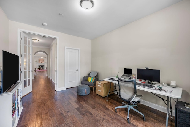 312 Rafferty Ct, Franklin, TN 37064 - office area featuring wood finished floors, crown molding, and arched walkways