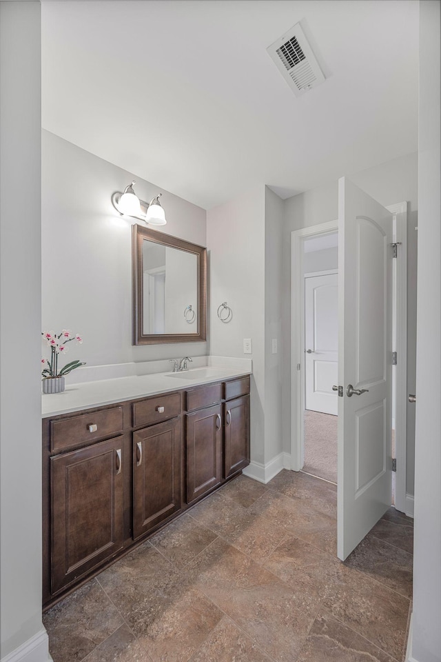 312 Rafferty Ct, Franklin, TN 37064 - bathroom featuring vanity and stone finish flooring
