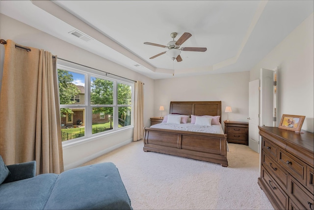 312 Rafferty Ct, Franklin, TN 37064 - bedroom with a tray ceiling, light colored carpet, and ceiling fan