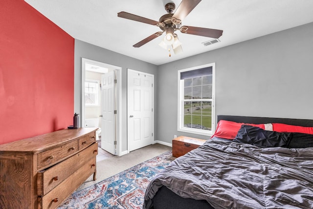 3299 Twelve Oaks Blvd, Clarksville, TN 37042 - bedroom featuring light carpet, multiple windows, ensuite bathroom, and ceiling fan