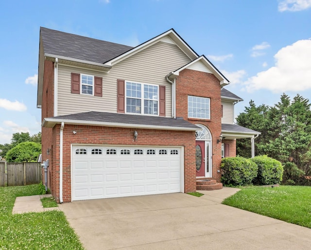 3299 Twelve Oaks Blvd, Clarksville, TN 37042 - traditional home featuring driveway, an attached garage, brick siding, and a shingled roof