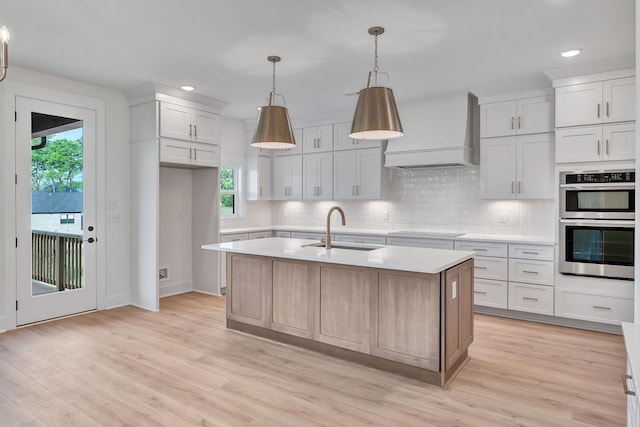 169 Willow Bend Dr, Hendersonville, TN 37075 - kitchen featuring custom exhaust hood, black electric stovetop, light countertops, plenty of natural light, and recessed lighting