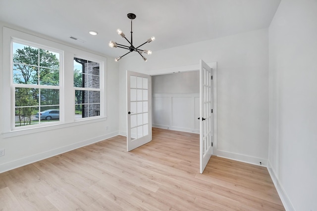 169 Willow Bend Dr, Hendersonville, TN 37075 - unfurnished bedroom featuring french doors, a chandelier, and light wood finished floors