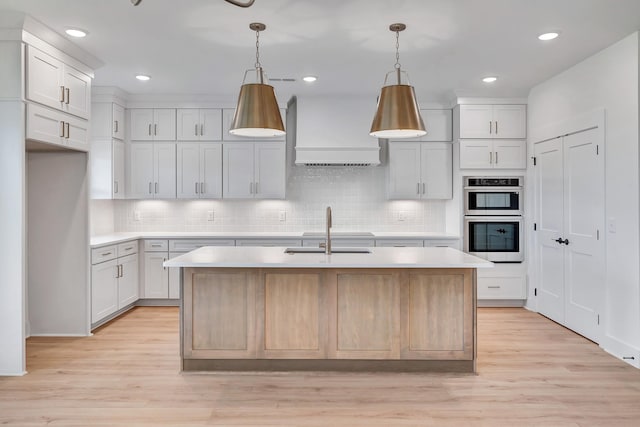 169 Willow Bend Dr, Hendersonville, TN 37075 - kitchen with stainless steel double oven, custom range hood, light countertops, tasteful backsplash, and recessed lighting