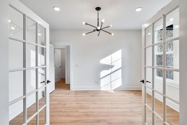 169 Willow Bend Dr, Hendersonville, TN 37075 - spare room featuring french doors, a chandelier, light wood-type flooring, and recessed lighting