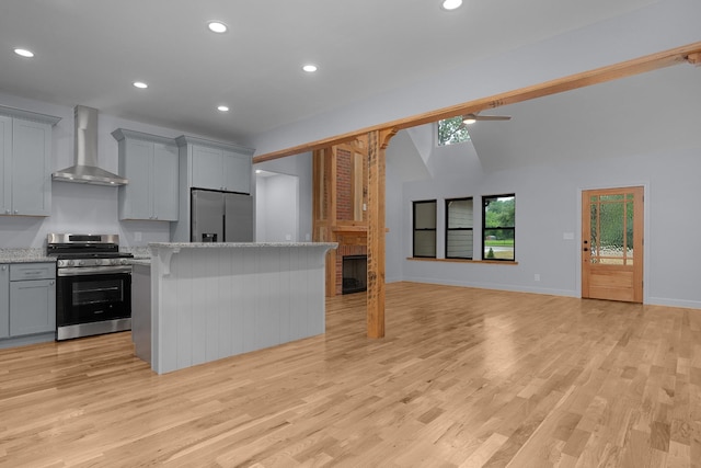 414 Ault Rd, Signal Mountain, TN 37377 - kitchen featuring appliances with stainless steel finishes, wall chimney range hood, gray cabinets, a center island, and recessed lighting