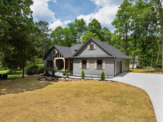 414 Ault Rd, Signal Mountain, TN 37377 - view of front of house featuring driveway, board and batten siding, and roof with shingles