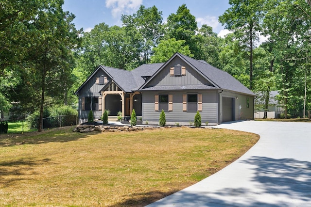 414 Ault Rd, Signal Mountain, TN 37377 - view of front of home featuring driveway, board and batten siding, a garage, and roof with shingles