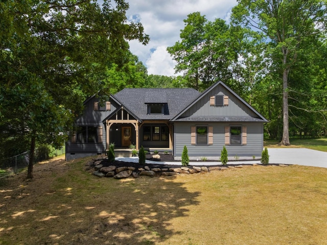 414 Ault Rd, Signal Mountain, TN 37377 - modern farmhouse featuring a front yard, roof with shingles, covered porch, and driveway