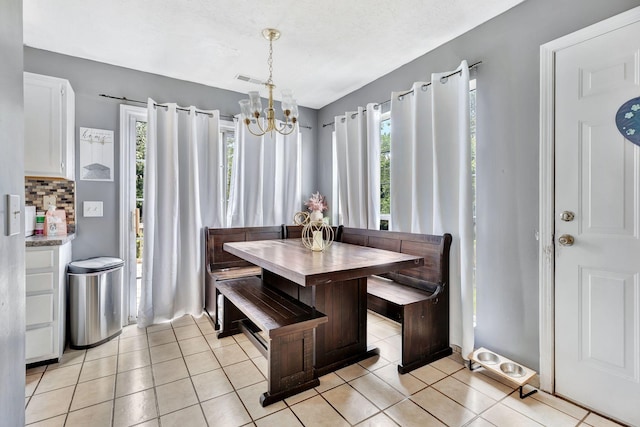 5601 Murphywood Xing, Antioch, TN 37013 - dining area featuring a chandelier and light tile patterned floors