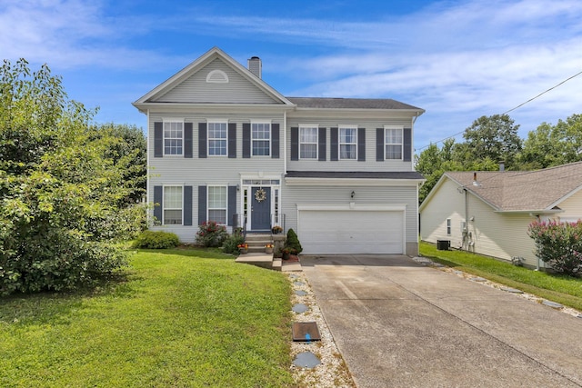 5601 Murphywood Xing, Antioch, TN 37013 - view of front of house featuring an attached garage, driveway, a front yard, and a chimney