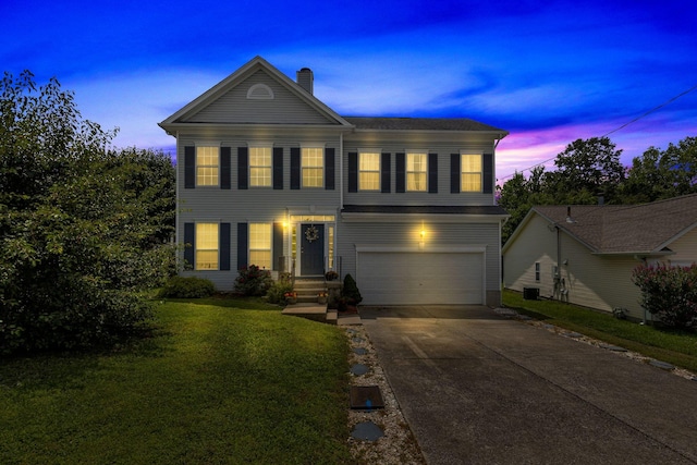 5601 Murphywood Xing, Antioch, TN 37013 - view of front of house with an attached garage, a chimney, a lawn, and driveway