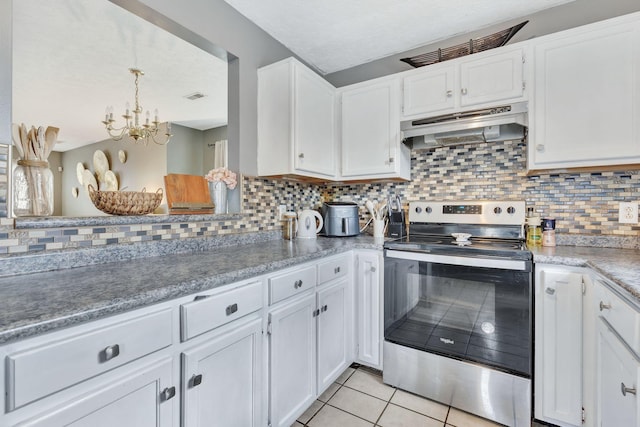 5601 Murphywood Xing, Antioch, TN 37013 - kitchen with stainless steel electric stove, under cabinet range hood, white cabinetry, and light tile patterned floors