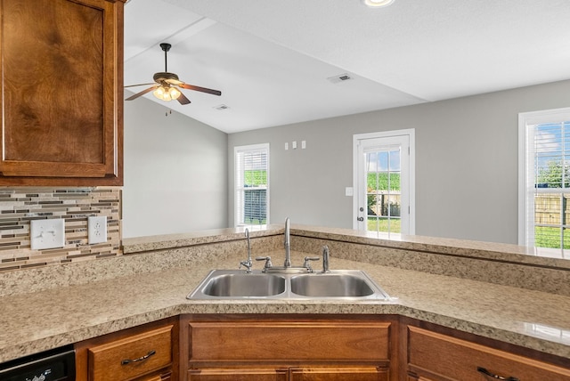 141 Bob White Trl, Oak Grove, KY 42262 - kitchen with ceiling fan, light countertops, lofted ceiling, healthy amount of natural light, and brown cabinets