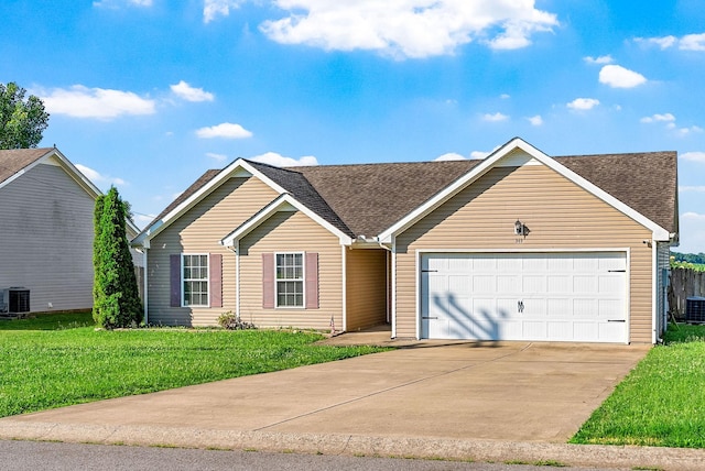 141 Bob White Trl, Oak Grove, KY 42262 - view of front of home featuring a garage, driveway, a shingled roof, and a front yard