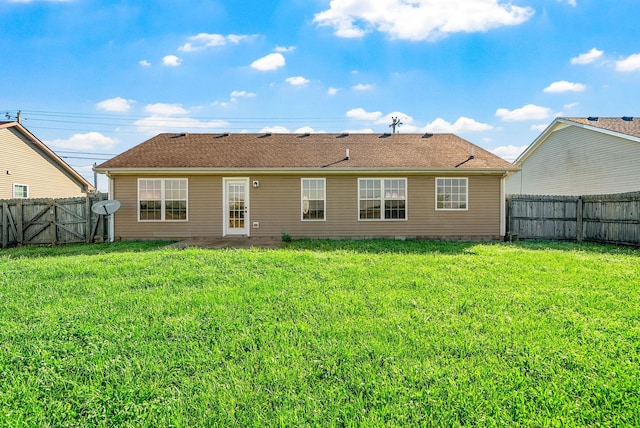 141 Bob White Trl, Oak Grove, KY 42262 - rear view of house with a fenced backyard and a gate