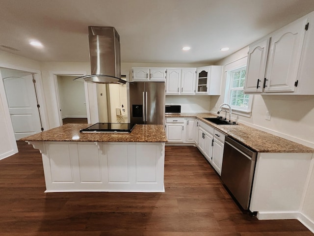 210 N Vine St, Tullahoma, TN 37388 - kitchen featuring stainless steel appliances, range hood, a center island, dark stone counters, and white cabinets