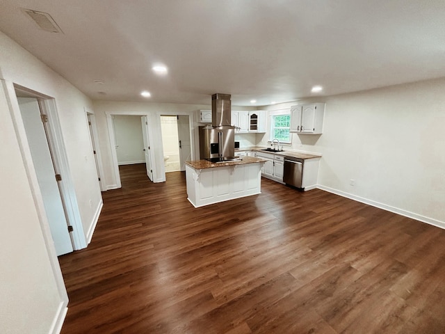 210 N Vine St, Tullahoma, TN 37388 - kitchen featuring stainless steel appliances, a kitchen island, white cabinets, recessed lighting, and dark wood-style flooring