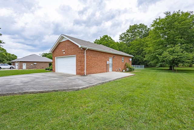 218 Susie Dr, Winchester, TN 37398 - view of side of home with brick siding, a yard, driveway, and an attached garage