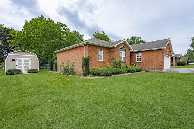 218 Susie Dr, Winchester, TN 37398 - view of front facade with brick siding, a shed, a front lawn, and driveway