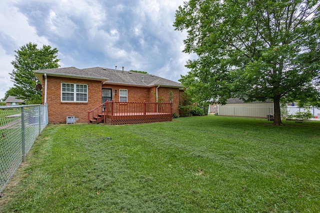 218 Susie Dr, Winchester, TN 37398 - back of property featuring a fenced backyard, a deck, brick siding, and a shingled roof