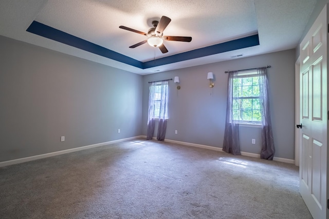 218 Susie Dr, Winchester, TN 37398 - carpeted spare room featuring a tray ceiling, a ceiling fan, and a textured ceiling