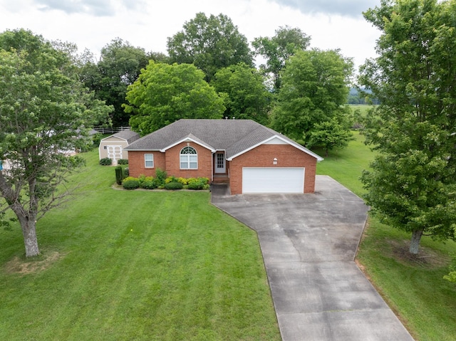 218 Susie Dr, Winchester, TN 37398 - single story home featuring asphalt driveway, a garage, a front yard, and brick siding