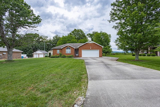 218 Susie Dr, Winchester, TN 37398 - ranch-style home with a front yard, an attached garage, concrete driveway, and brick siding