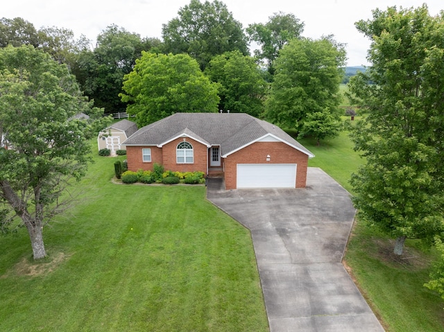 218 Susie Dr, Winchester, TN 37398 - view of front of property with driveway, a front lawn, brick siding, a garage, and roof with shingles