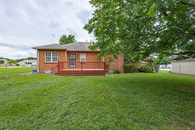 218 Susie Dr, Winchester, TN 37398 - rear view of property with a fenced backyard, brick siding, a wooden deck, and a shingled roof