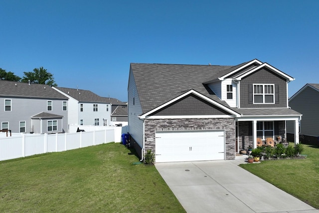 7050 Scotlyn Way, White House, TN 37188 - view of front of home featuring concrete driveway, stone siding, an attached garage, a porch, and roof with shingles