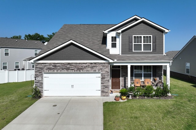 7050 Scotlyn Way, White House, TN 37188 - craftsman inspired home with driveway, a porch, stone siding, and an attached garage