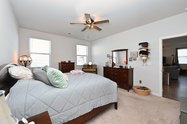 7050 Scotlyn Way, White House, TN 37188 - bedroom featuring multiple windows, light colored carpet, and ceiling fan