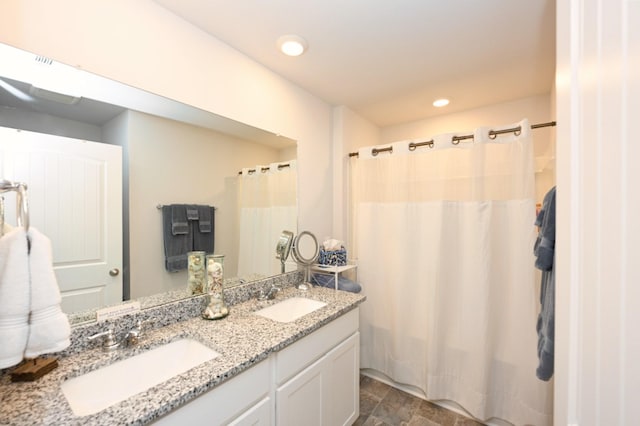 7050 Scotlyn Way, White House, TN 37188 - full bathroom with double vanity, a shower with curtain, recessed lighting, and stone finish flooring