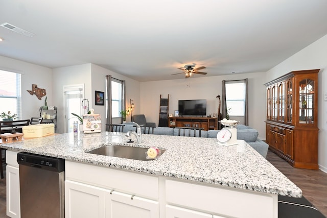 7050 Scotlyn Way, White House, TN 37188 - kitchen with stainless steel dishwasher, a ceiling fan, dark wood finished floors, open floor plan, and light stone countertops