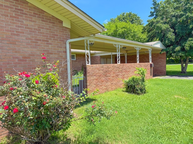 115 Horseshoe St, Pulaski, TN 38478 - view of side of home with a yard and brick siding